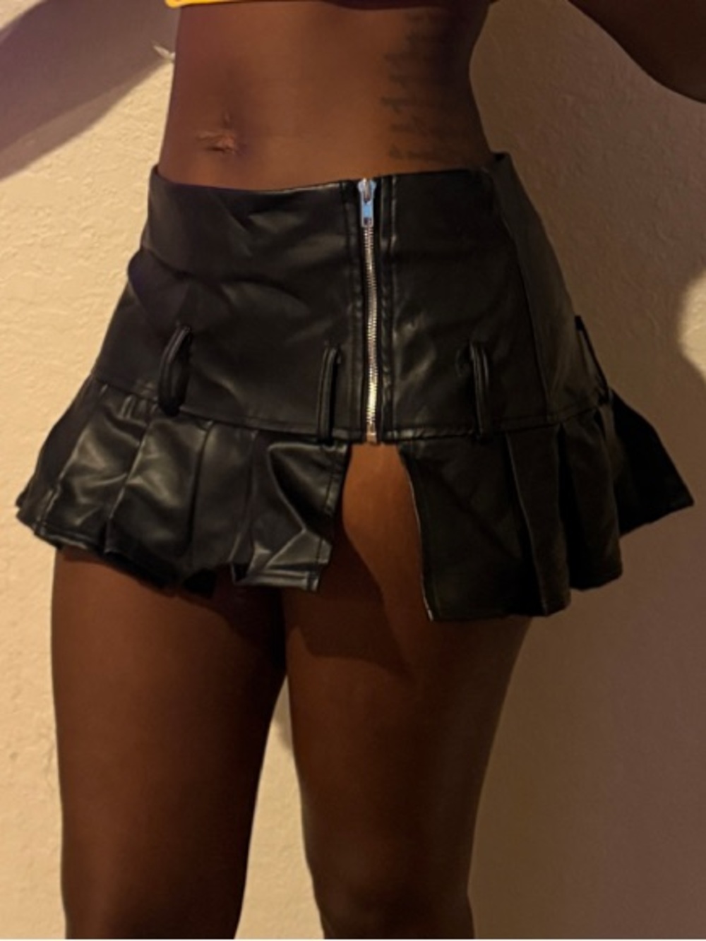 Black Faux Leather Mini Skirt with Pleated Hem
